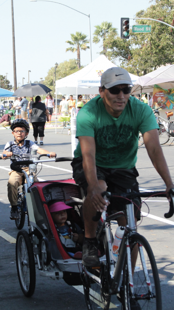 parent and kid on bike