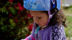 girl wearing bicycle helmet