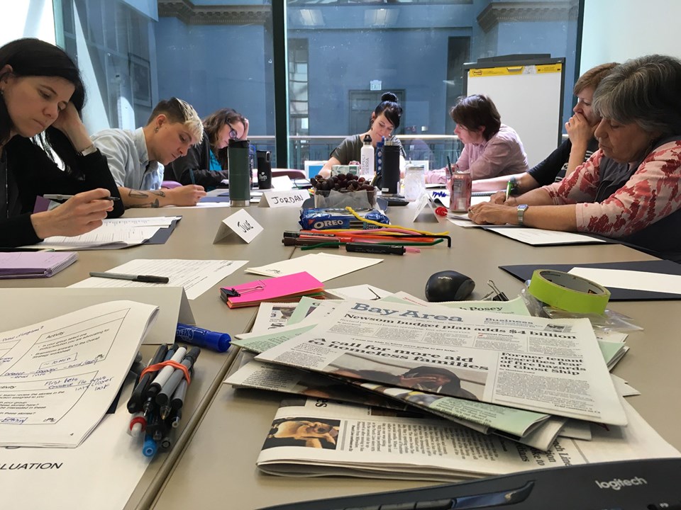 Members of End Hep C SF sitting at a table