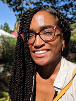 outdoor color headshot of Alana Black